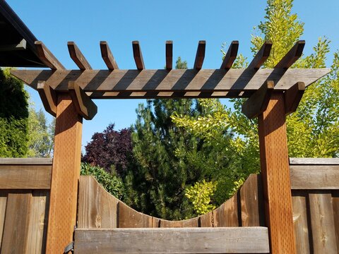 brown wooden fence and gate with lattice