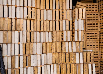 Wooden crates stacked in pile