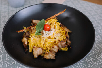  Homemade spaghetti carbonara topping with fried bacon and grilled pork