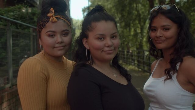 Three mixed race sisters on a day out in Sheffield, South Yorkshire, England.