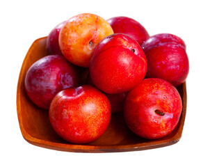 Sweet red plums on wooden table