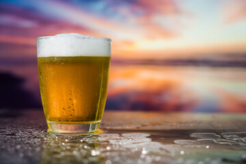 Glass of beer on a sunset