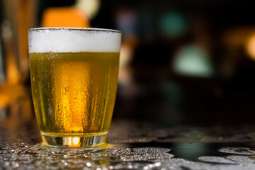 Beer glass on the bar counter.