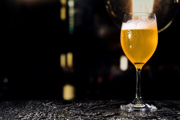 Beer glass on the bar counter.