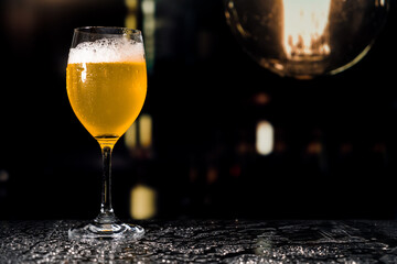 Beer glass on the bar counter.