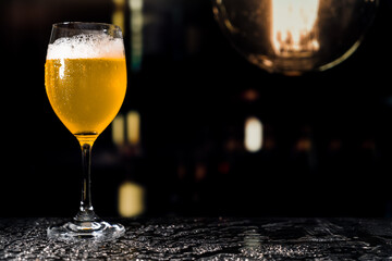 Beer glass on the bar counter.