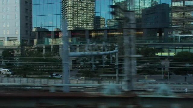 window view from moving train with motion blur . Video for mass transportation, travel and city life concept.