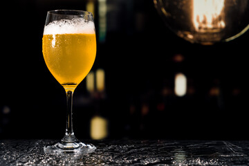 Beer glass on the bar counter.