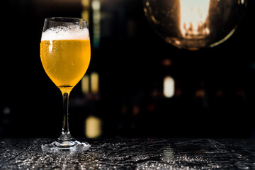 Beer glass on the bar counter.