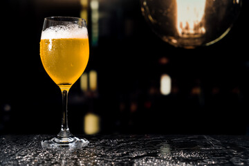 Beer glass on the bar counter.