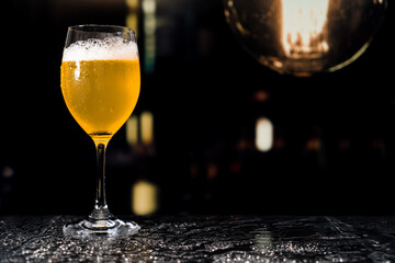 Beer glass on the bar counter.