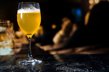 Beer glass on the bar counter.