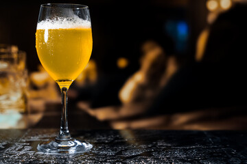 Beer glass on the bar counter.