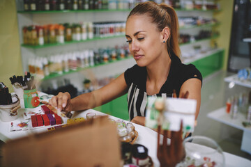 Young Caucasian woman shop owner enjoying entrepreneurship business