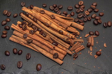 large grains of coffee Arabica with cinnamon