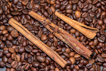 large grains of coffee Arabica with cinnamon