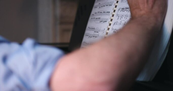 Close up of man playing the piano.