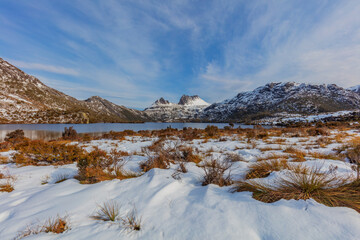 Beautiful evening light over snow covered Cradle Mountain.Cradle Mountain  - Lake St Clair National...