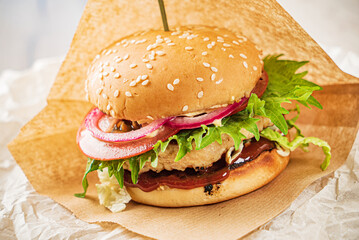 burger with meat cutlet and vegetables