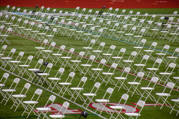 Obraz premium Rows of folding chairs at commencement