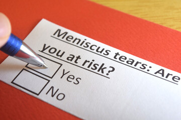 Obraz premium One person is answering question about meniscus tears.