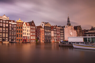 Fototapeta premium Row houses along a canal in Amsterdam