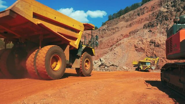 MS PAN Dump truck and bulldozer in quarry / TabenRodt, Rhineland-Palatinate, Germany