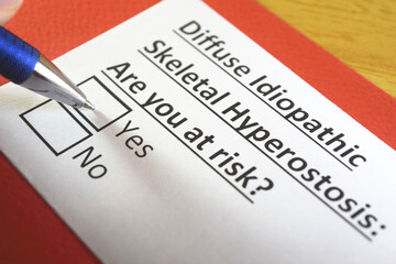 Obraz premium One person is answering question about diffuse idiopathic skeletal hyperostosis.