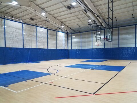 Basketball Court With Wood Floor In Gym