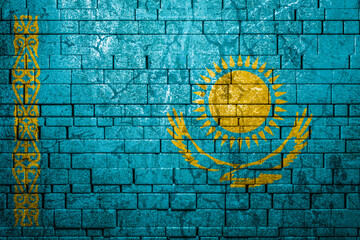 National flag of Kazakhstan on brick  wall background.The concept of national pride and symbol of...