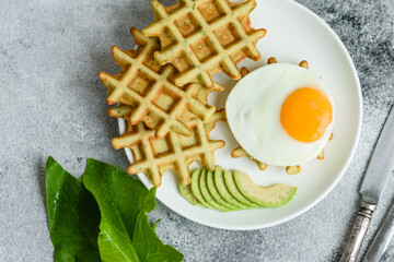 Fresh delicious and nutritious breakfast with waffles with spinach