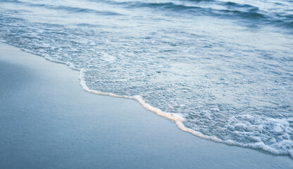 Soft wave of the sea on the sandy beach.Summer vacation background.