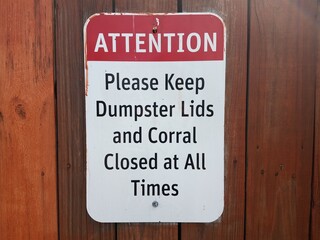 attention please keep dumpster lids closed sign