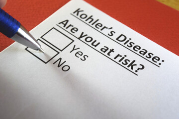 Fototapeta premium One person is answering question about kohler's disease.