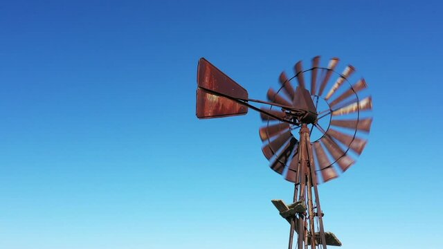 CU American-style windmill against blue sky / Plattsburg, Missouri, USA
