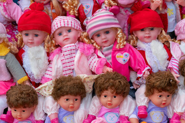 Fototapeta na wymiar Beautiful cute baby dolls for sale at retail shop at Christmas market, New Market area, Kolkata, West Bengal, India.