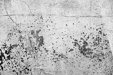 Texture of a concrete wall with cracks and scratches which can be used as a background