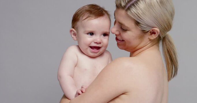 SLO MO MS Young mother hugging and kissing baby son (6-11 months)