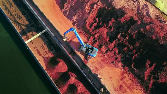 AERIAL WS Rocks being loaded in barge in harbor/ Merzig, Saarland, Germany