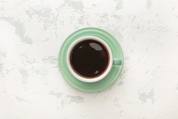 Obraz na płótnie Canvas Cup of hot coffee on white background, top view