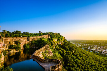 View during sunset from Chittor or Chittorgarh Fort with city in backdrop. It is one of the largest...