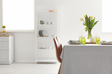 Obraz na płótnie Canvas Served table in modern dining room