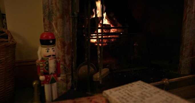 CU HANDHELD Christmas gifts near fireplace / Dinton, Wiltshire, UK