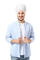 Handsome young Indian man on white background
