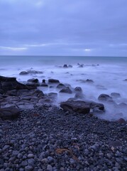 Fototapeta na wymiar Rocks on beach sunrise Pivot Beach Portland Victoria Australia
