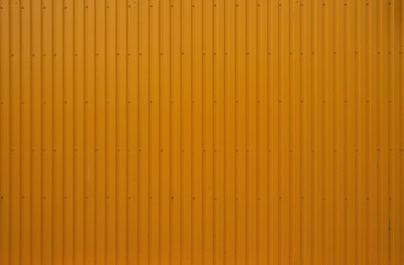 Texture of orange metal wall with straight lines for background