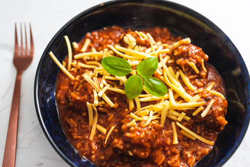 plant-based food, vegan meatballs with rice and tomato sauce topped with dairy-free cheese