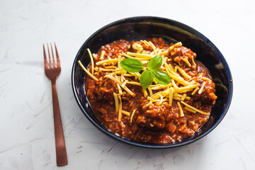 plant-based food, vegan meatballs with rice and tomato sauce topped with dairy-free cheese