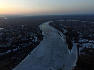 Aerial view of the countryside (drone image).Near river Desna.Winter time.Sunset. Near Kiev,Ukraine