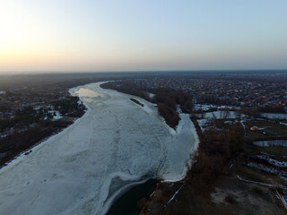 Aerial view of the countryside (drone image).Near river Desna.Winter time.Sunset. Near Kiev,Ukraine